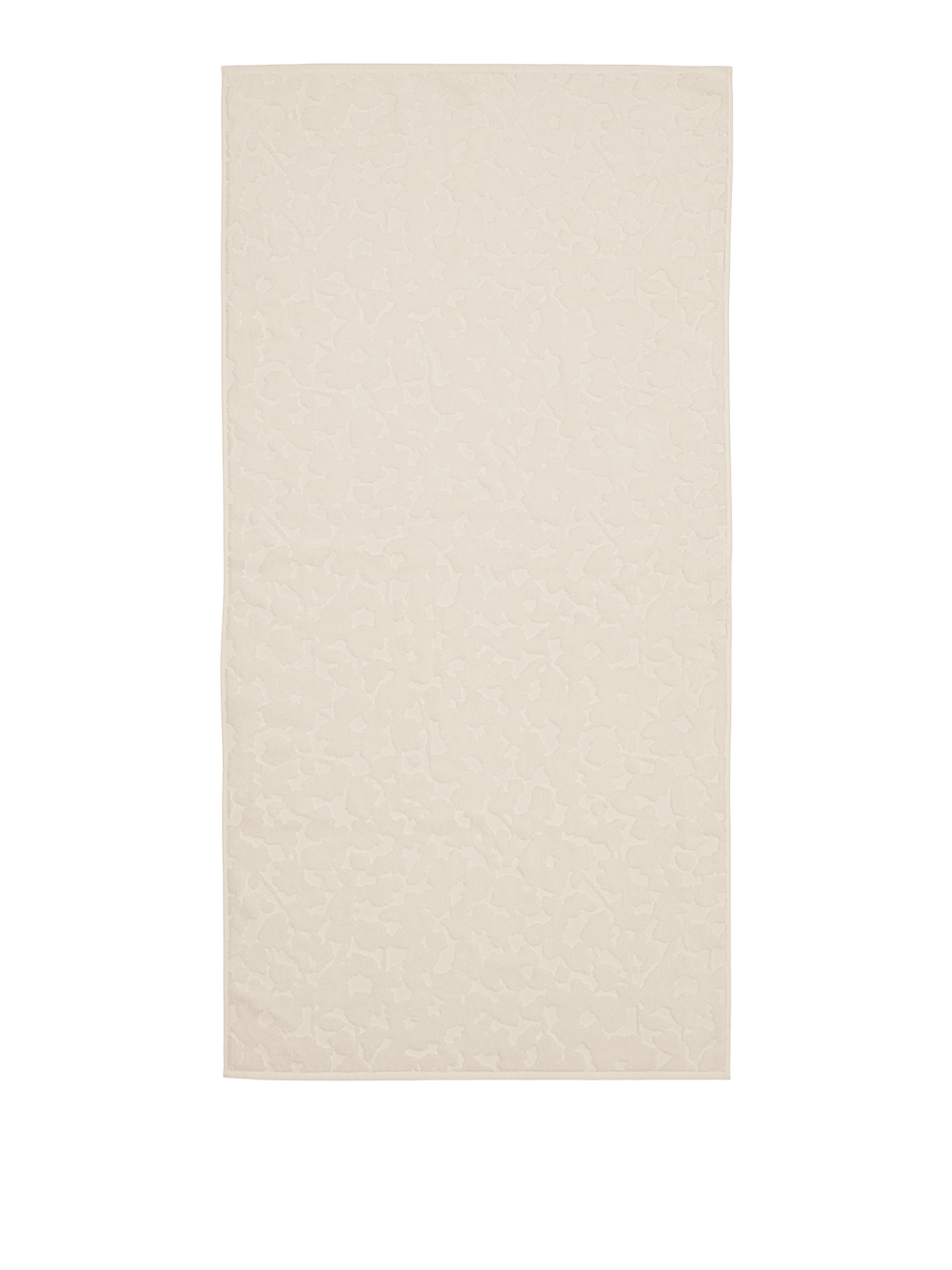 Bath towel in off-white laid flat, showing the raised tonal floral relief across the surface
