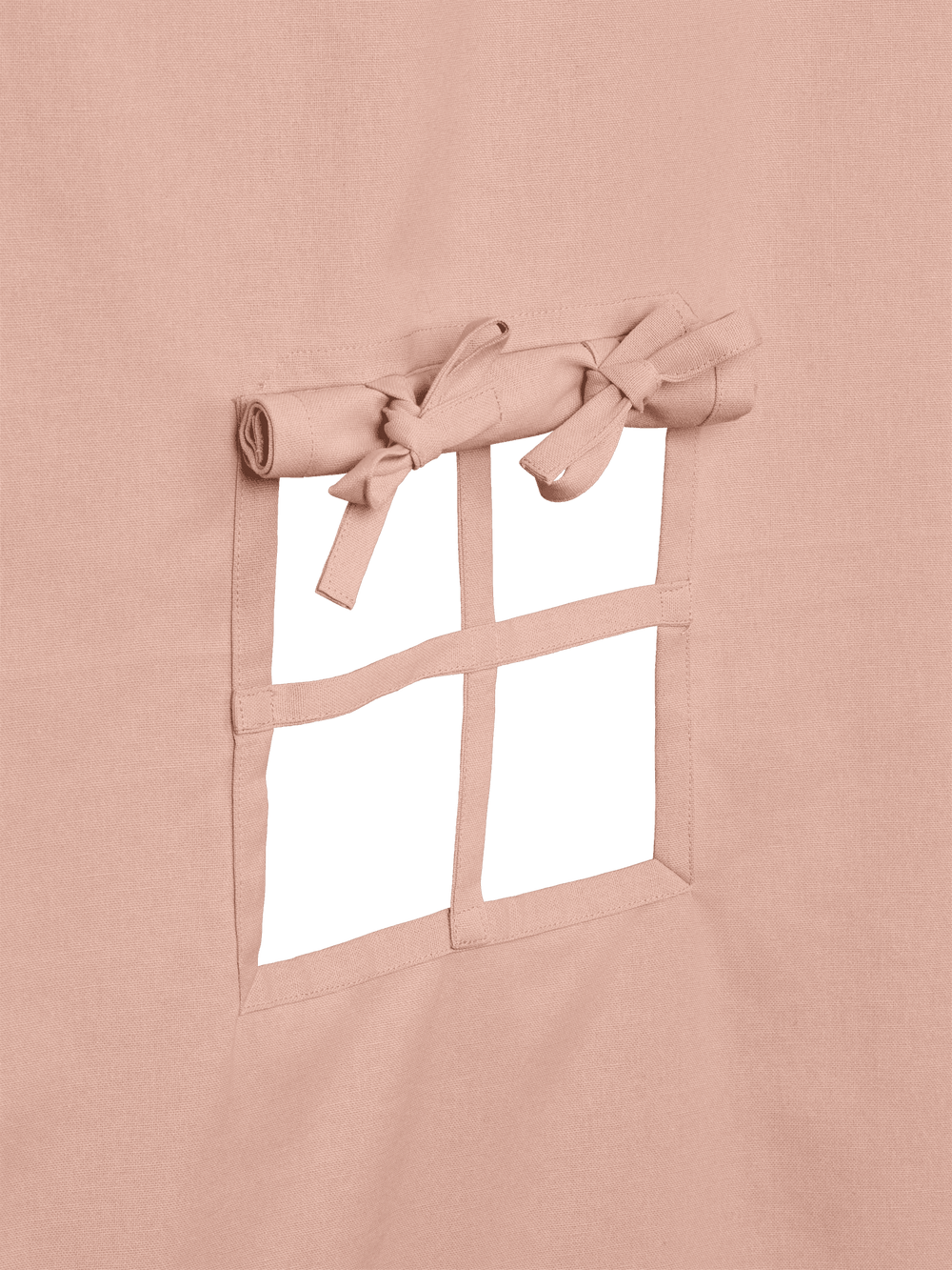 Close-up of the cut-out window with fabric bars and rolled-up curtain tied with a bow